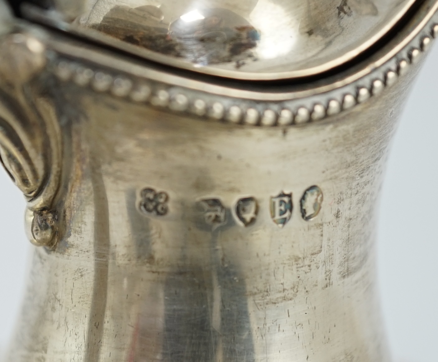 A late Victorian silver pedestal hot water jug, by Jackson & Chase